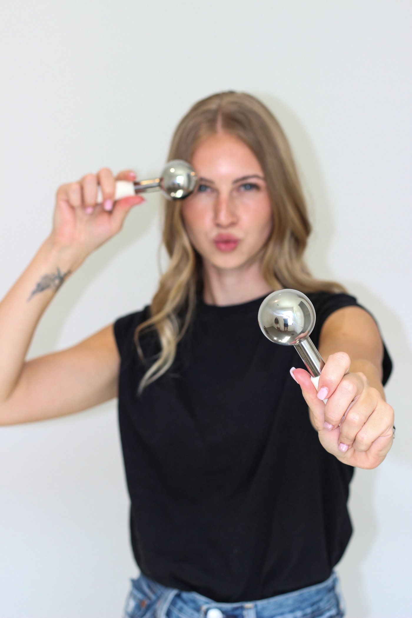 Jayslyn Tramp holding two metal facial globes